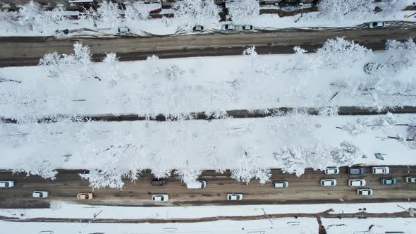 Aerial Top Down View of Snowy City Asphalt Road Landscapes in Winter