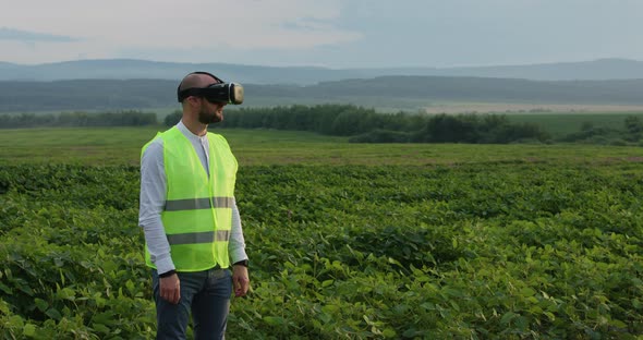 Farm Specialist Engineer Using Technology VR Monitoring Harvest Working for Agriculture Productivity