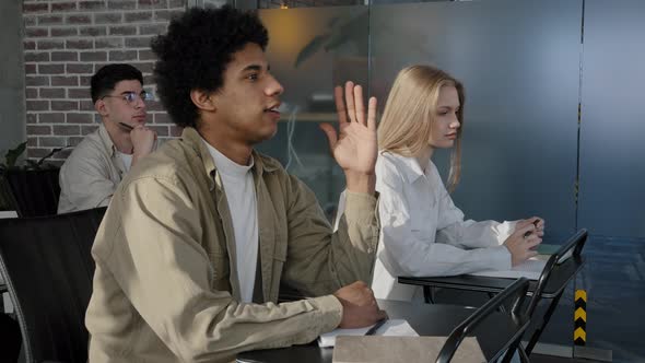 Diverse Students Sit in Classroom at School Lesson Listen to Lecture Studying in College Teacher