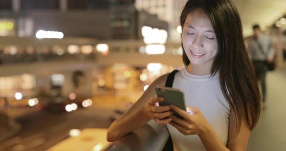 Woman use of cellphone at night 