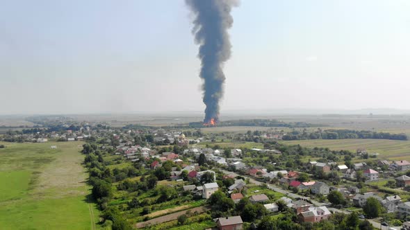 Aerial View of Huge Fire View From Quadcopter. Black Smoke Rises High Into the Sky. Fire on the alt