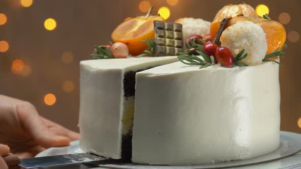 Super Closeup of Hand Taking a Slice of Chocolate Cake with Cheese Souffle