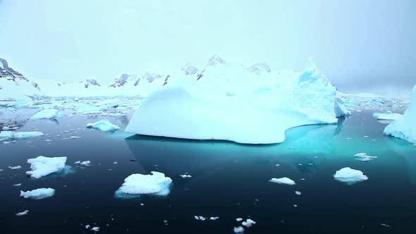 Sailing past icebergs in Antarctica