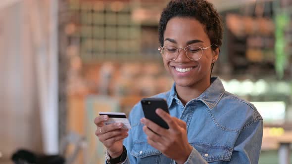 Portrait of Online Payment By African Woman on Smartphone, Success