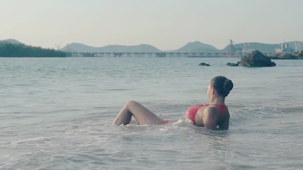 Elegant Woman Enjoys Warm Sea on Tropical Coast Slow Motion