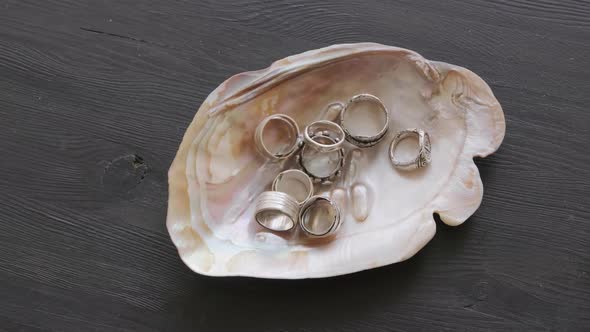 Jeweler Showcasing Rings in Seashell