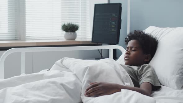 Sick Boy in Hospital Bed