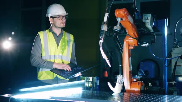 Construction Engineer is Observing Cybernetic Devices