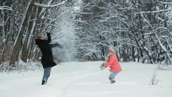 Children Playing With Snow in the Park