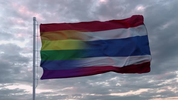 Waving Flag of Thailand and LGBT Rainbow Flag Background