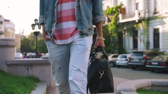 Close Up Shot of Young Stylish Handsome Man with Bag Walking in Old City Center Slow Motion