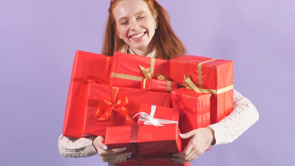 Happy Playful Girl Holding Many Beautiful Christmas Present