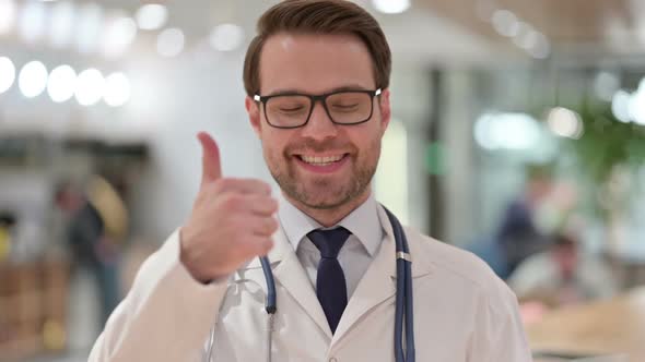 Portrait of Male Doctor Showing Thumbs Up Sign