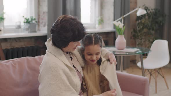 Portrait Of Loving Grandma With Granddaughter