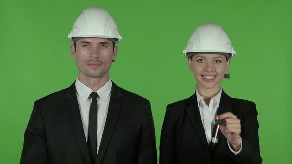 Happy Male and Female Business Professionals Standing with Arms Crossed, Chroma Key