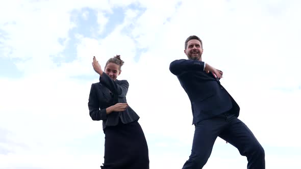 Successful Man and Woman Happy Business Professionals Dance in Sky Success