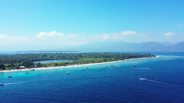 Beautiful flying tourism shot of a summer white paradise sand beach and aqua turquoise water backgro