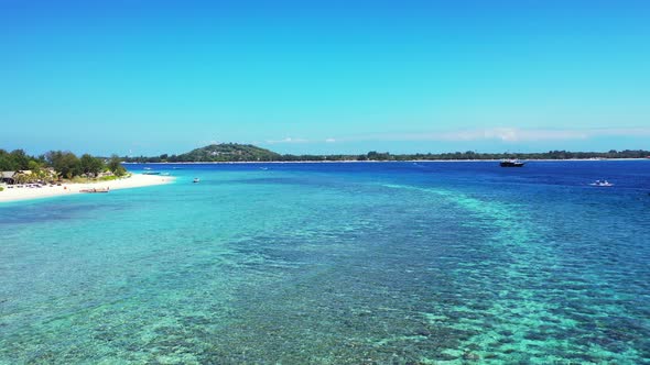 Natural above island view of a white paradise beach and turquoise sea background in best quality 4K