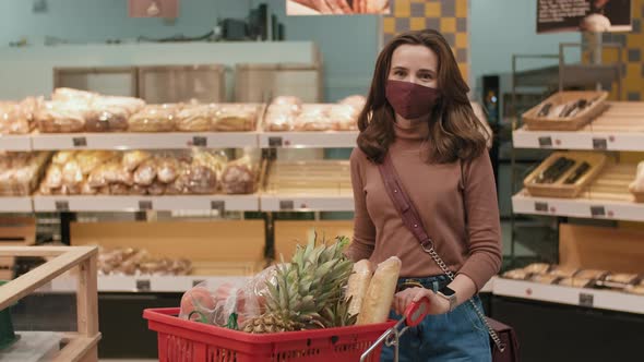 Woman With Shopping Cart In Hypermarket