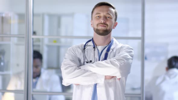 Confident Caucasian Male Physician Smiling for Photos