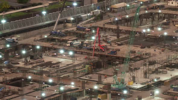 Time lapse of construction site with heavy construction machinery in metropolis