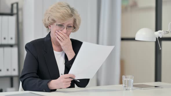 Old Businesswoman Disappointed By Loss on Documents