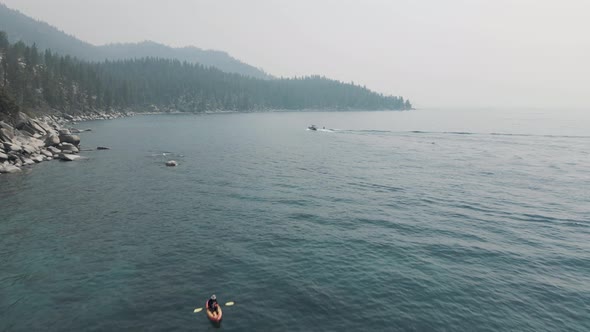 Water sports on the lake. Riding on a wakeboard.