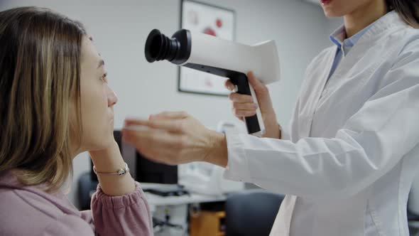 Close Up View of The Ophthalmologist Examines the Patient's Eye