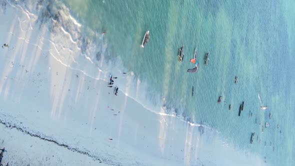 Vertical Video Boats in the Ocean Near the Coast of Zanzibar Tanzania Aerial View