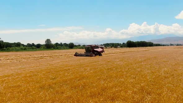 Aerial view of Broken Down Combine Harvester In Agricultural Field