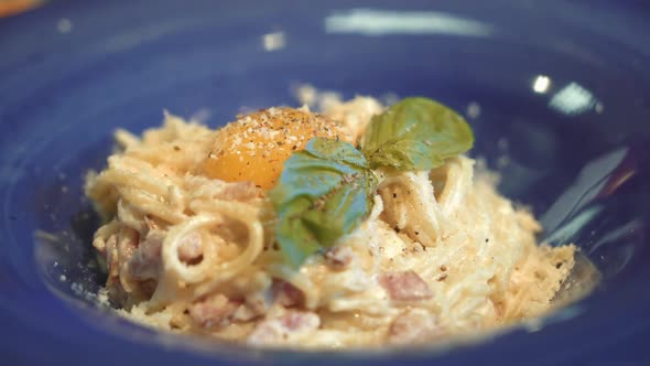 Pasta Carbonara. Spaghetti with bacon, basil, parmesan cheese and yolk. Italian Cuisine.