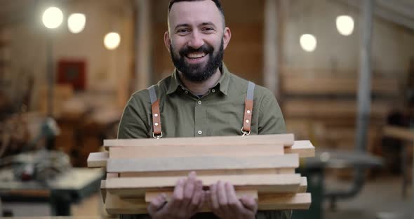 Man Working with Wood at the Joinery