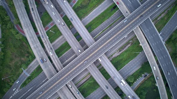 Aerial view shot of fast moving above interchange and multi junction road