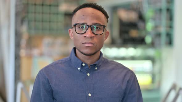 Young African Man Looking at the Camera 