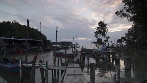 Sunset at broken wooden bridge.