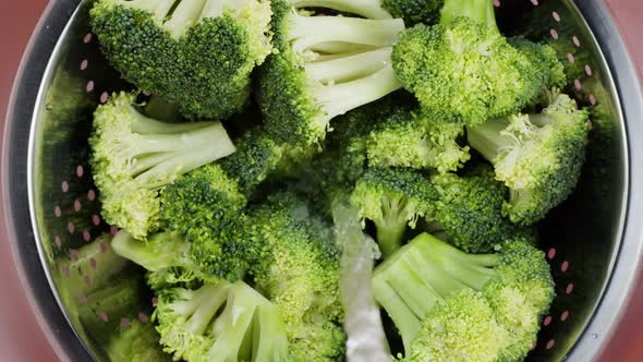 Pouring Water Into Broccoli Top View Washing Fresh Green Broccoli Closeup Vitamins Raw Food and