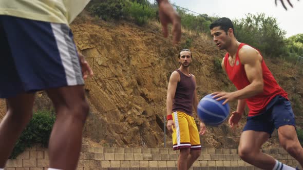 Basketball players practicing in basketball court