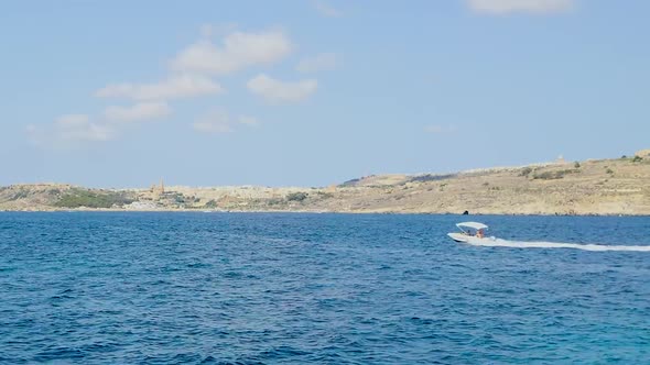 Small boat in the ocean near Malta Islands