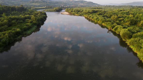 Dunajec River in Poland At Early Morning. Low Clouds and Mist and Fog Over River. 