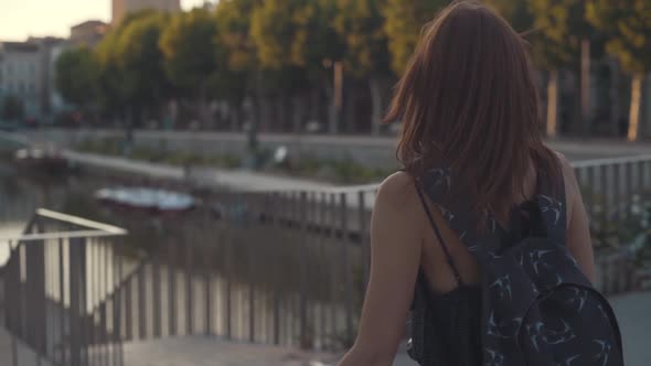 A Beautiful Woman Tourist Walks Through the Historical Center of the French City of Narbonne