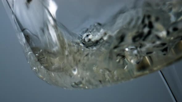 Closeup White Wine Bubbling Splashing in Goblet