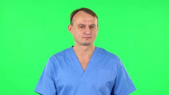 Medical Man Flirts, Blows a Kiss and Winks, Green Screen