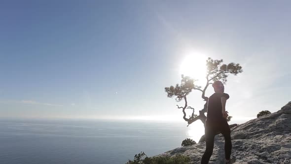 Young Woman Walking and Running on a Mountain. Lady on the Summit in Beautiful Scenery Facing the