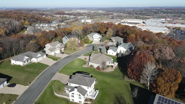 Aerial view of Eau Claire residential neighborhood with large shopping center seen in distance.