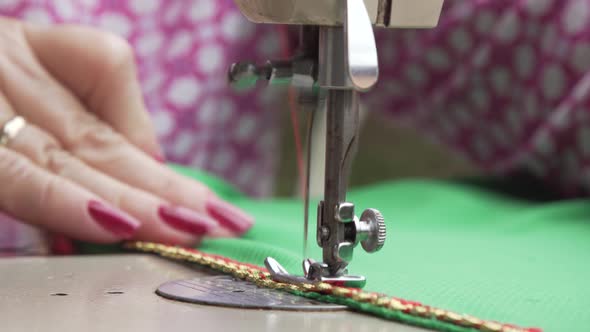 hands of a sewing machine