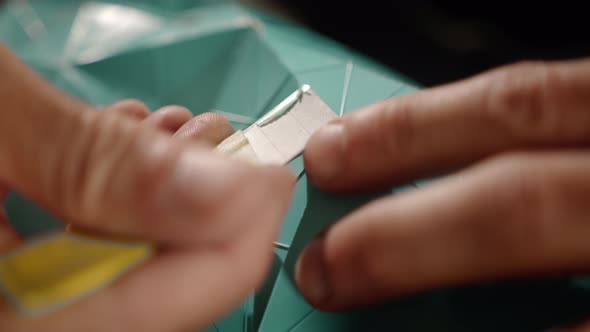 Close-up: a man works with a blade. Production of decorative elements. Workshop.