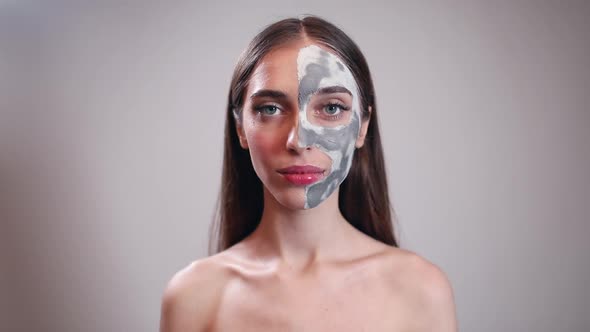 Smiling Young Girl with Clay Mask on Half Face