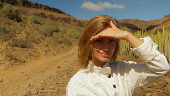 Model Wearing Long-Sleeves With Hand Covering Eyes from Sun