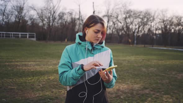 Portrait of Young Cute Attractive Young Girl in Park Background