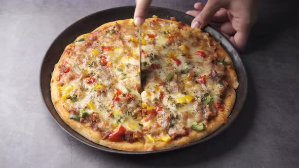 Cutting Slice of Cheese Pizza on a Plate on Wooden Table